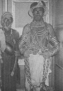 A-mast-qalandar-with-his-attendant,-Pakistan