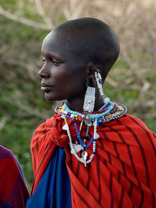 Maasai woman in traditional clothing and jewellery in the Serengeti National Park, Tanzania