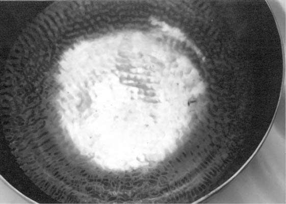 making a fountain of water inside a singing bowl